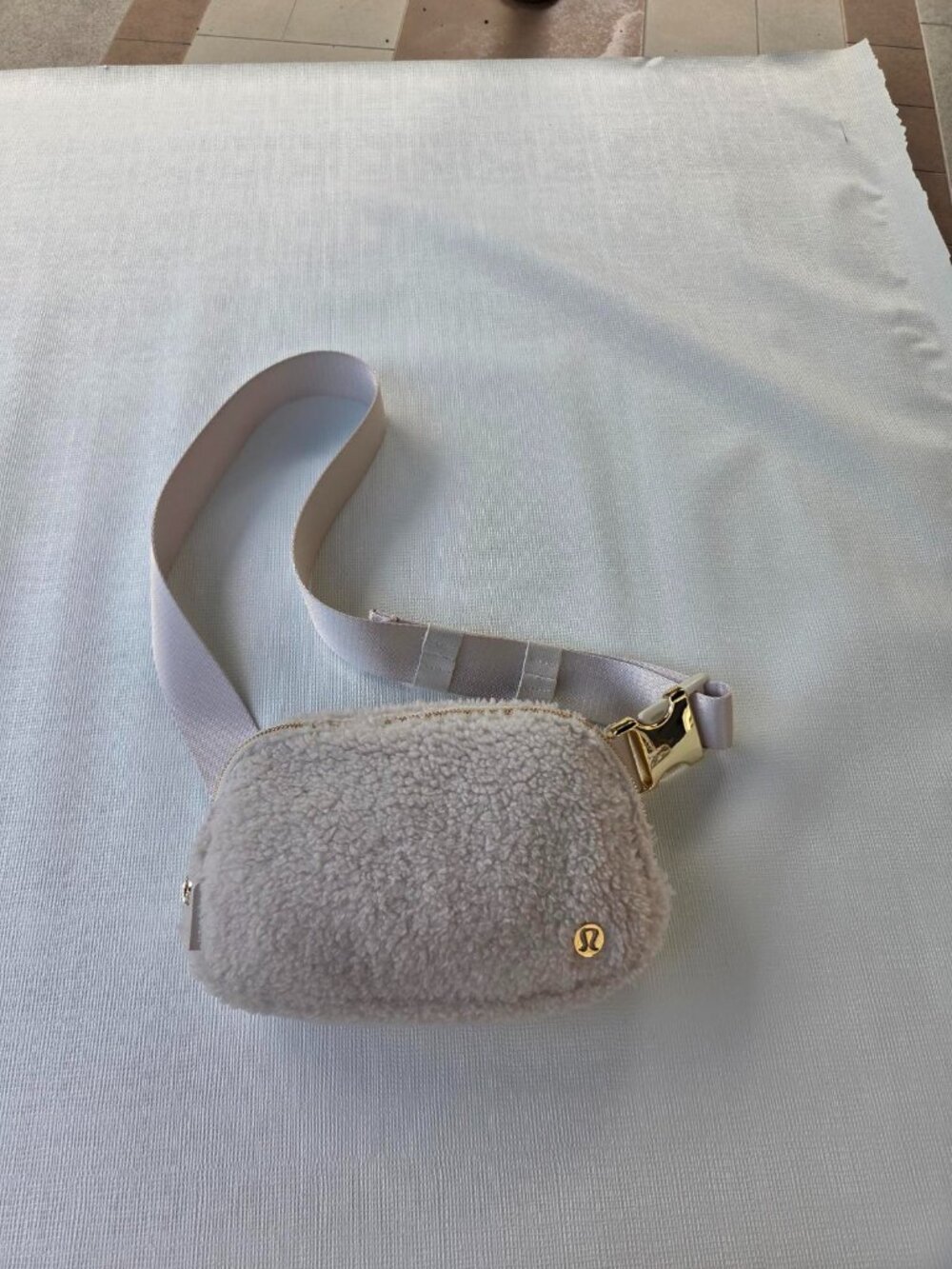 Lululemon Everywhere Belt Bag. Color is Ivory, Material is Teddy Fleece.